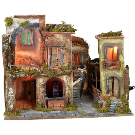 Nativity scene with illuminated village z, working oven and fountain