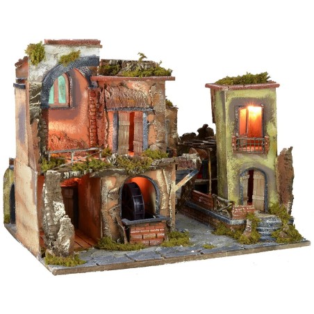 Nativity scene with illuminated village z, working oven and fountain