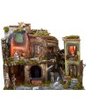 Nativity scene complete with statues with illuminated village, oven and