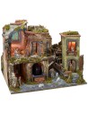 Nativity scene complete with statues with illuminated village, oven and