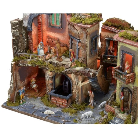 Presepe completo di statue con borgo illuminato, forno e