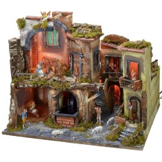 Nativity scene complete with statues with illuminated village