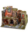 Nativity scene complete with statues with illuminated village, oven and
