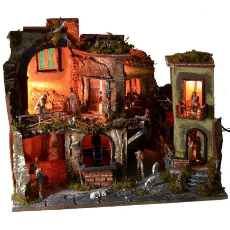 Pesebre completo con estatuas, pueblo iluminado, horno y fuente