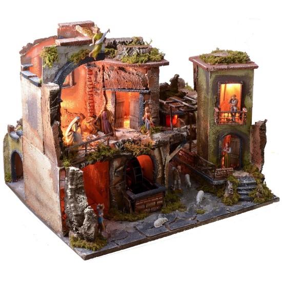 Complete nativity scene with statues, illuminated village, and oven