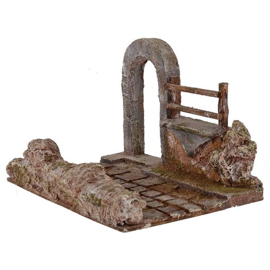 Strada con porta ad arco e staccionata rialzata per presepe