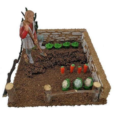Vegetable garden with farmer landi spade
