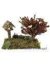Pradera con casita y árbol con pájaros