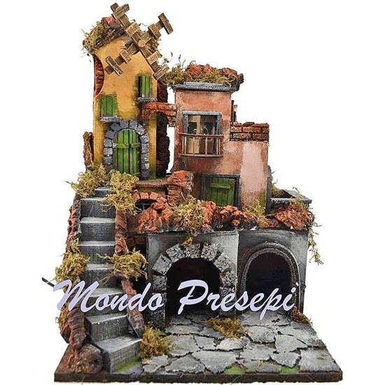 The crib with the village lit up and the mill 30x30x40 h.