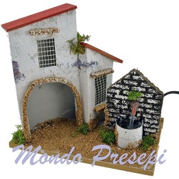Casa con fontana presepe cm 21x13x18 h.