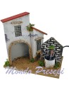 Casa con fuente para belén de 21x13x18 cm de altura.