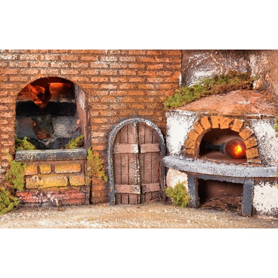 Illuminated Neapolitan village with oven, windmill and waterfall