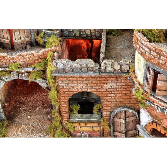 Illuminated Neapolitan village with oven, windmill and waterfall