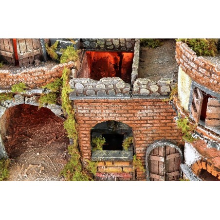 Illuminated Neapolitan village with oven, windmill and waterfall