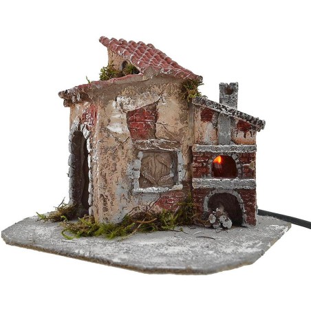 Casa in resina con forno funzionante cm 19x16x15 h. Mondo