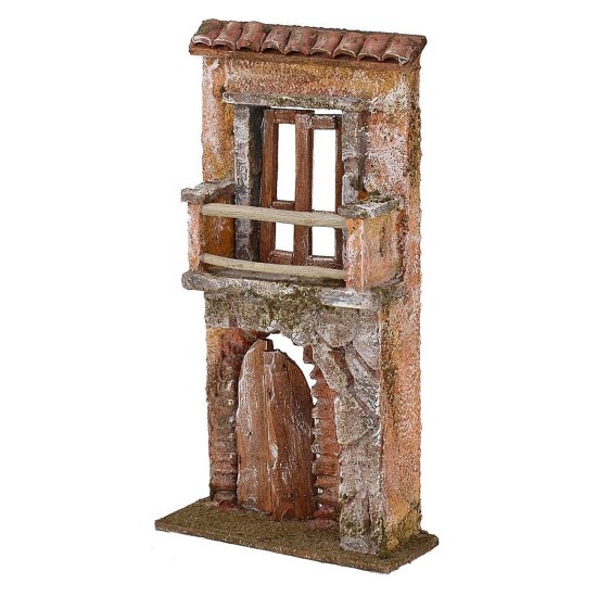 Fachada de casa con balcón y portón cm