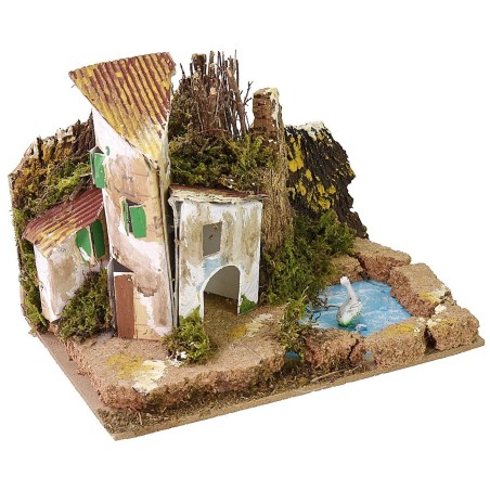Grupo de casitas con estanque para belén de 15x10,5 cm.