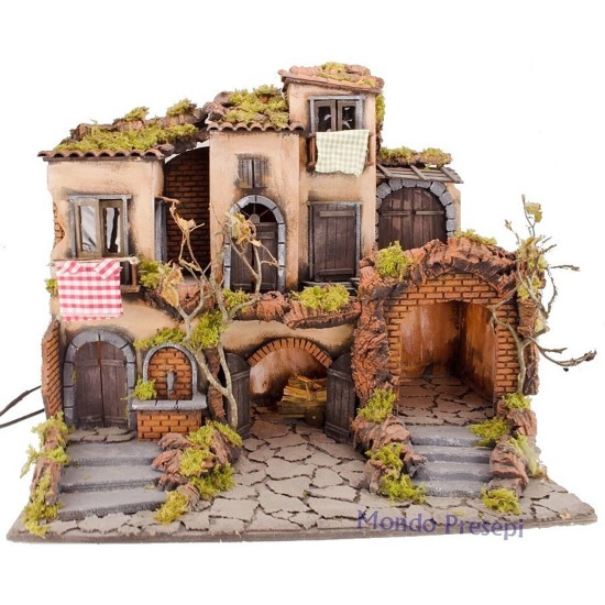 18th century Neapolitan Nativity scene with illuminated village and fountain