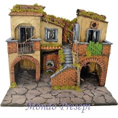 The crib with the village lit up with the oven 50x40