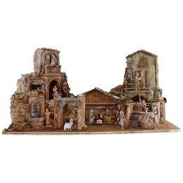 Illuminated nativity scene complete with Landi statues with houses and fountain