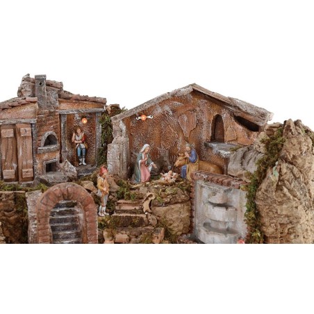 Illuminated nativity scene complete with Landi statues and landscape