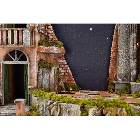 Belén iluminado con cielo estrellado de fibra óptica, fuente.