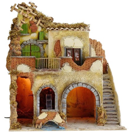 Aldea iluminada con molino de agua y de viento en funcionamiento cm