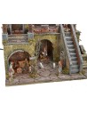 Illuminated nativity scene complete with Landi statues with starry sky