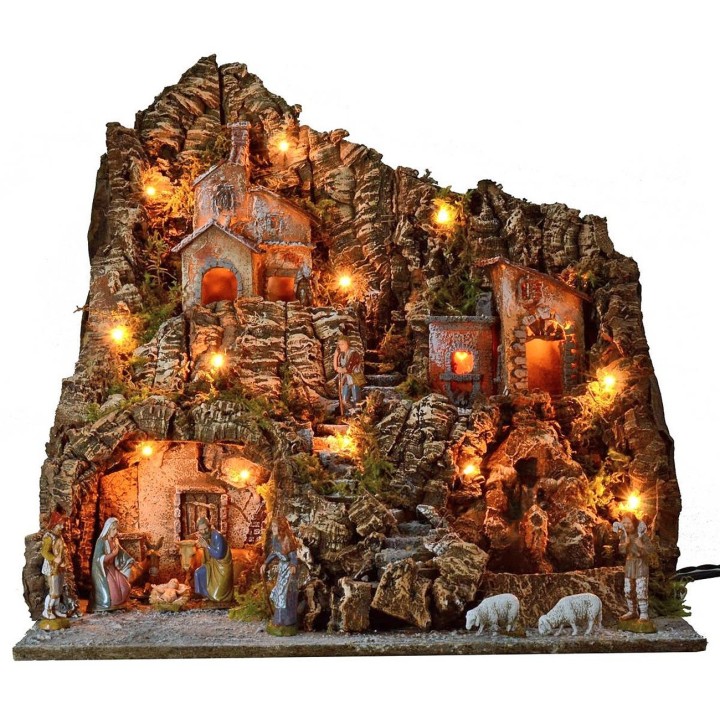 Illuminated nativity scene complete with Landi statues with oven and waterfall