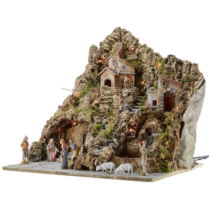 Illuminated nativity scene complete with Landi statues with oven and waterfall