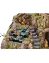 Illuminated nativity scene complete with Landi statues with fire and waterfall