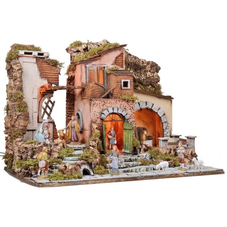Illuminated nativity scene complete with Landi statues with mill
