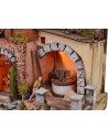 Illuminated nativity scene complete with Landi statues with mill