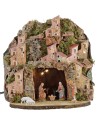 Illuminated nativity scene complete with Landi statues with village