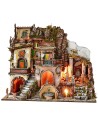 Illuminated nativity scene with fountain and working fire