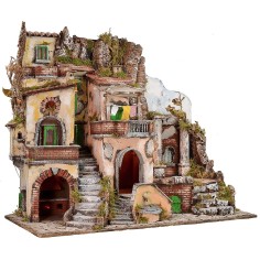 Illuminated nativity scene with functioning fountain and fire