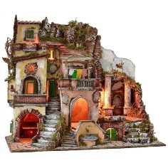 Illuminated nativity scene with functioning fountain and fire 2