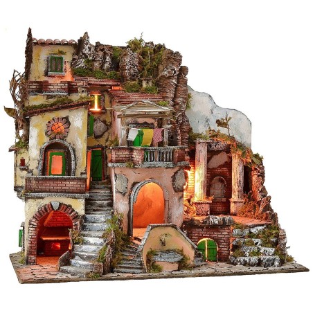 Illuminated nativity scene with functioning fountain and fire