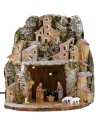 Illuminated snow-covered nativity scene complete with Landi