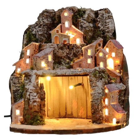 Presepe innevato illuminato con villaggio e grotta cm 20x20x24