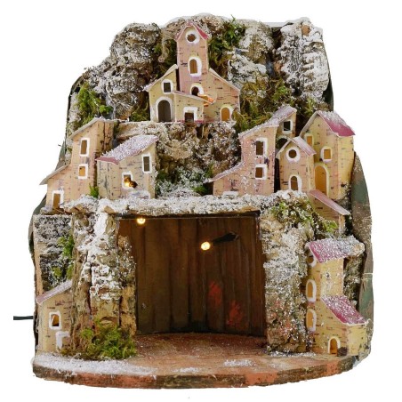 Presepe innevato illuminato con villaggio e grotta cm 20x20x24