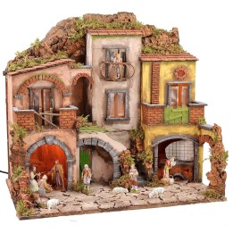 Illuminated Neapolitan nativity scene complete with Landi statues