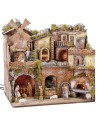 Illuminated Neapolitan nativity scene with oven, waterfall and