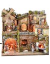 Illuminated Neapolitan nativity scene with oven, waterfall and