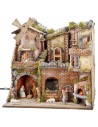 Illuminated Neapolitan nativity scene with oven, waterfall and