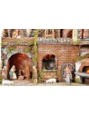 Illuminated Neapolitan nativity scene with oven, waterfall and