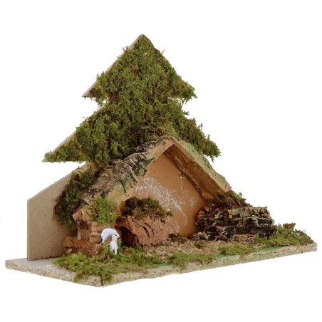 Tree with light-illuminated hut with piles of batteries cm