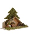 Tree with light-illuminated hut with piles of batteries cm