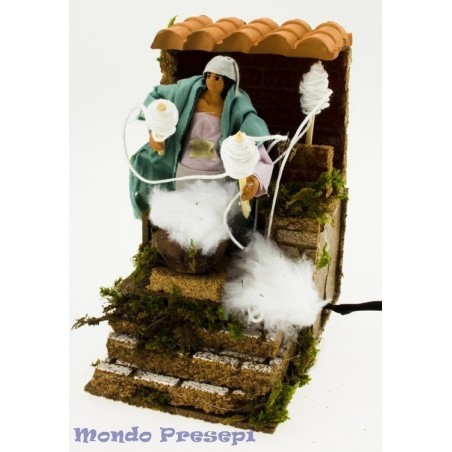Woman in motion spinning wool 10 cm