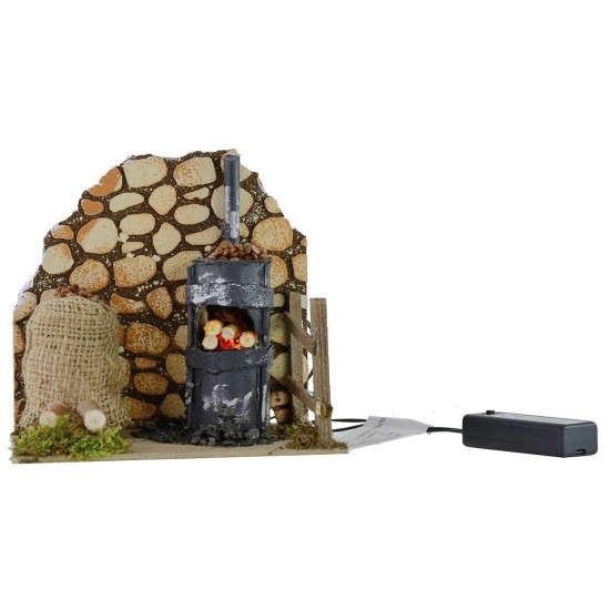 Escenario para castañera con horno en funcionamiento de